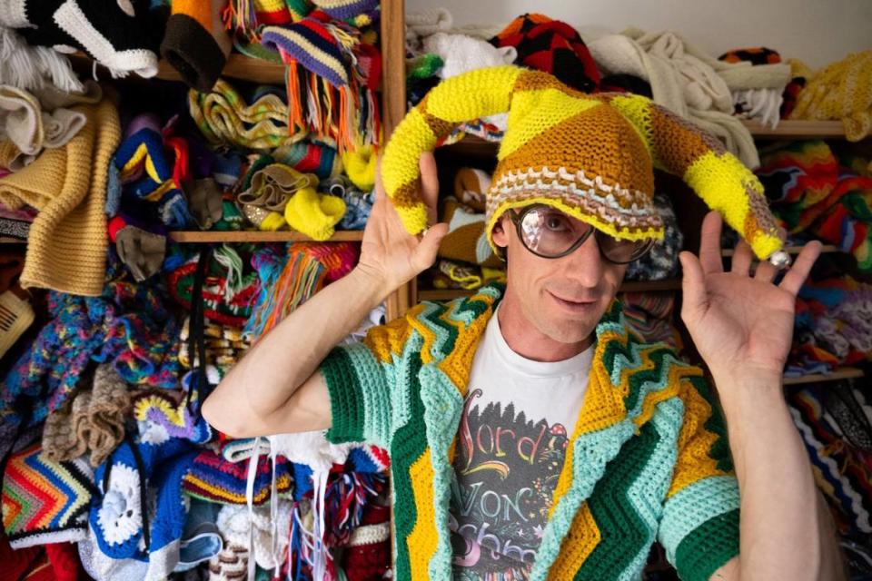 Fashion designer Schuyler Ellers models a hat in his studio earlier this month near Nevada City. His clothing line, Lord von Schmitt, is made from crochet blankets and throws.