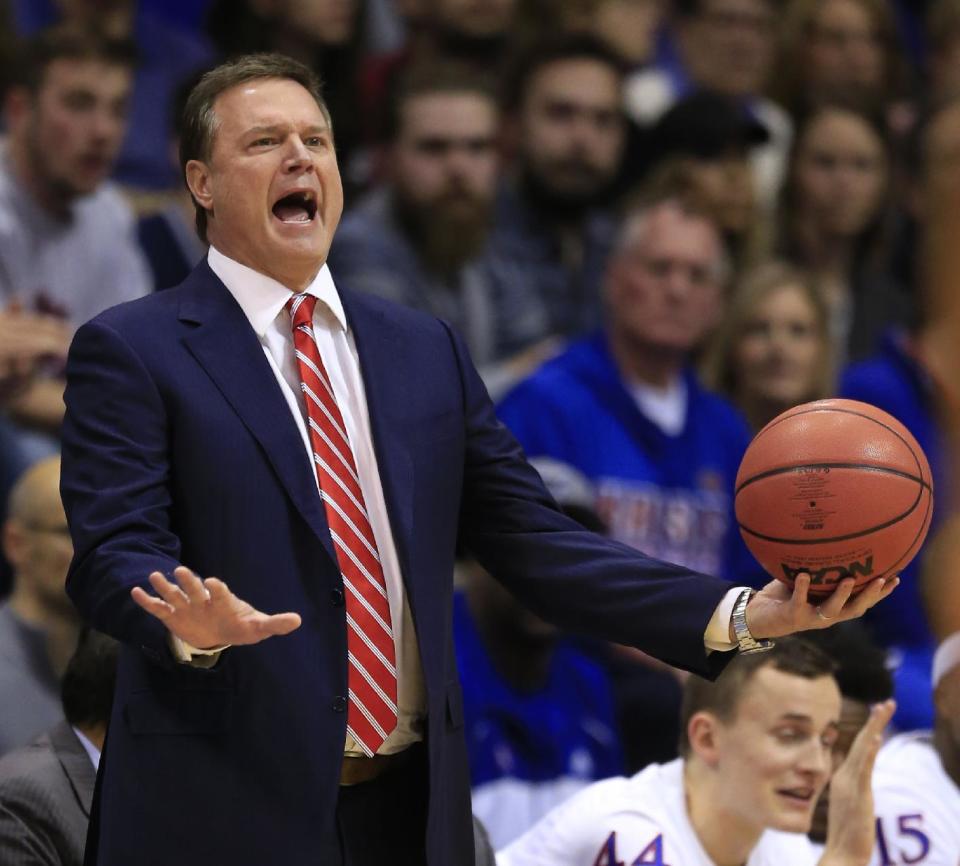 FILE - In this Jan. 7, 2017, file photo, Kansas head coach Bill Self holds the ball while directing his team during the first half of an NCAA college basketball game against Texas Tech in Lawrence, Kan. Kansas coach Bill Self says star freshman Josh Jackson will play in the NCAA Tournament despite several off-the-court issues and allegations that Jackson and his representatives tried to bribe a student to make a vandalism accusation go away. (AP Photo/Orlin Wagner, File)