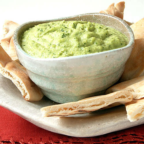 <p>This recipe uses frozen shelled edamame in place of chickpeas. It is also good as a spread on flatbread for a wrap sandwich or as a dip with cut-up raw vegetables. Add extra flavor to the pita chips by lightly toasting them, then rubbing them with the cut side of a halved raw garlic clove.</p> <p> <a rel="nofollow noopener" href="http://www.myrecipes.com/recipe/soybean-hummus-10000001206213/" target="_blank" data-ylk="slk:View Recipe: Soybean Hummus" class="link ">View Recipe: Soybean Hummus</a></p>