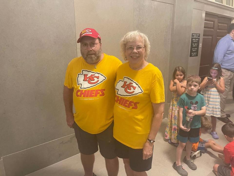 Rusty and Chris Thomas, Chiefs fans from Jefferson City, wait in line to see the Vince Lombardi Trophy at the Missouri Capitol.