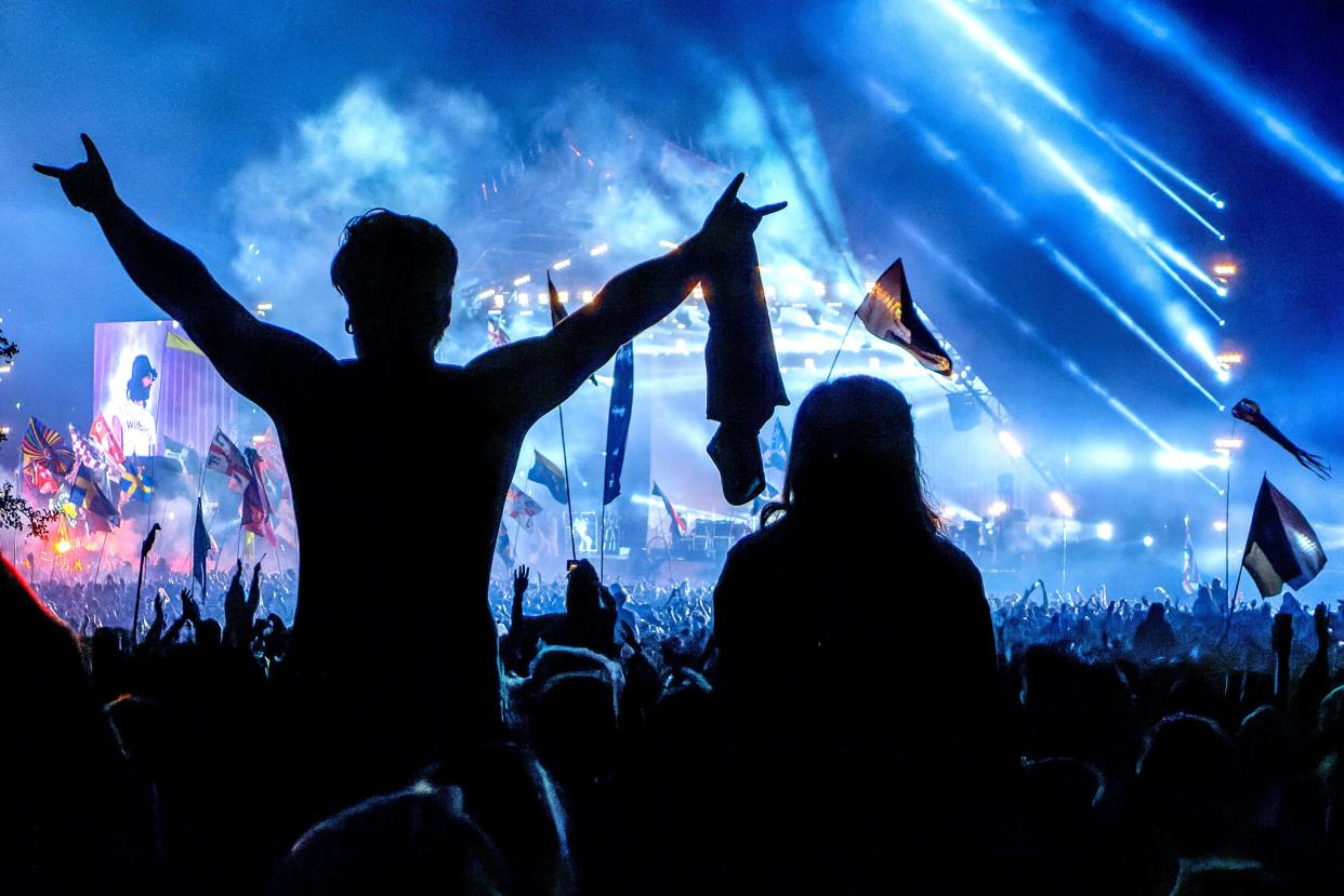 Glastonbury, June 29th 2014: In the crowd at the Pyramid Stage, during Kasabian's set