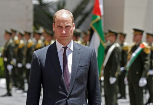 Britain's Prince William reviews honour guards before meeting Palestinian president Mahmud Abbas in the West Bank city of Ramallah on June 27, 2018