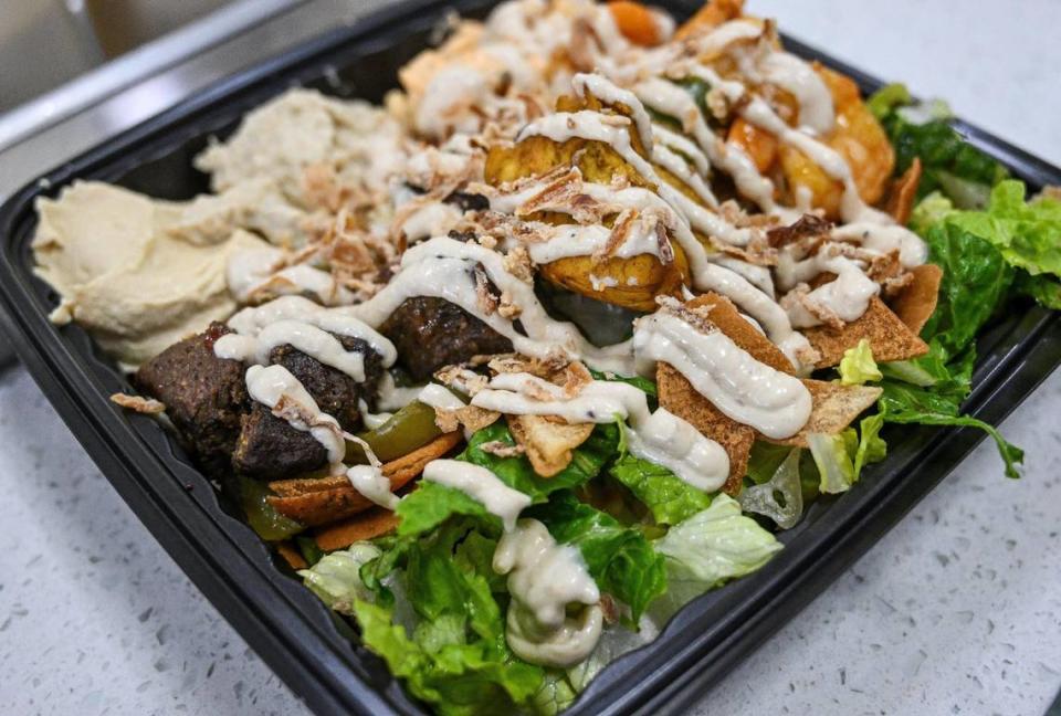 A custom plate made to order from Kabab Time features a choice of three proteins, sauces and toppings.