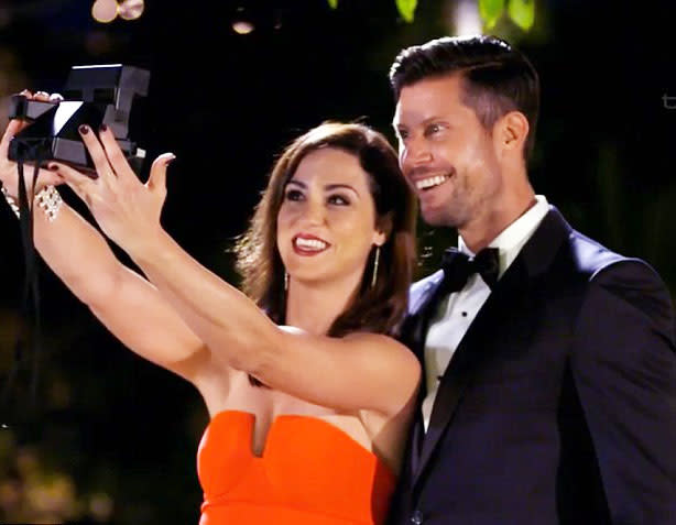 A photo of Jacinda Gugliemino and Sam Wood taking a polaroid selfie on The Bachelor Australia in 2015.