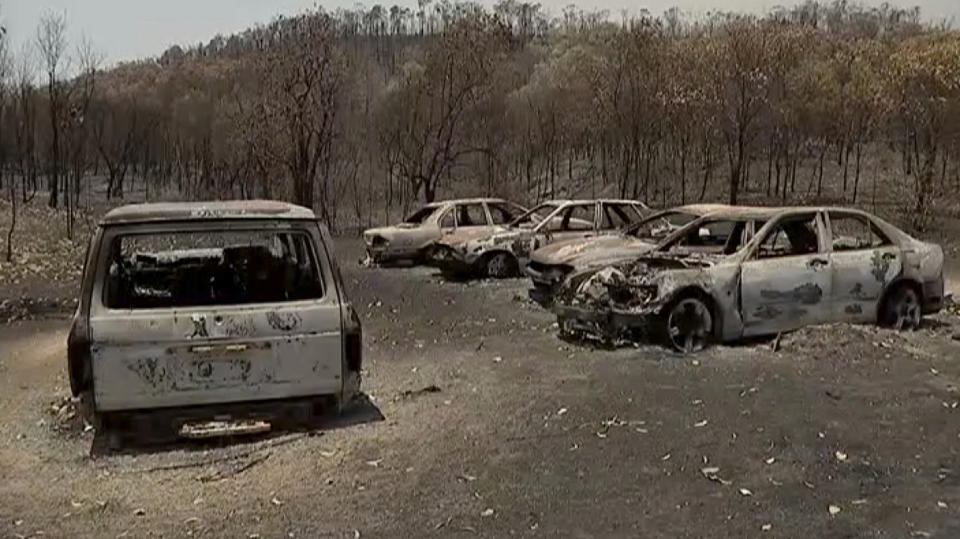 This image made from video shows destroyed cars after wildfires in Yeppoon, Queensland state, Australia, Wednesday, Nov. 13, 2019. In Queensland, more than 70 wildfires were burning across the state.(Australian Broadcasting Corporation via AP)