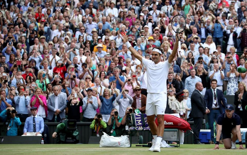 Roger Federer acknowledges the crowd after beating Tomas Berdych on day eleven of the Wimbledon Championships at The All England Lawn Tennis and Croquet Club - PA