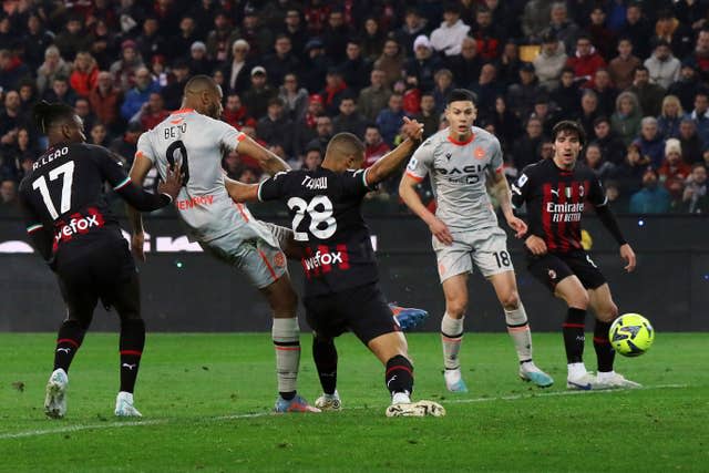 Udinese’s Beto scores their second goal against AC Milan