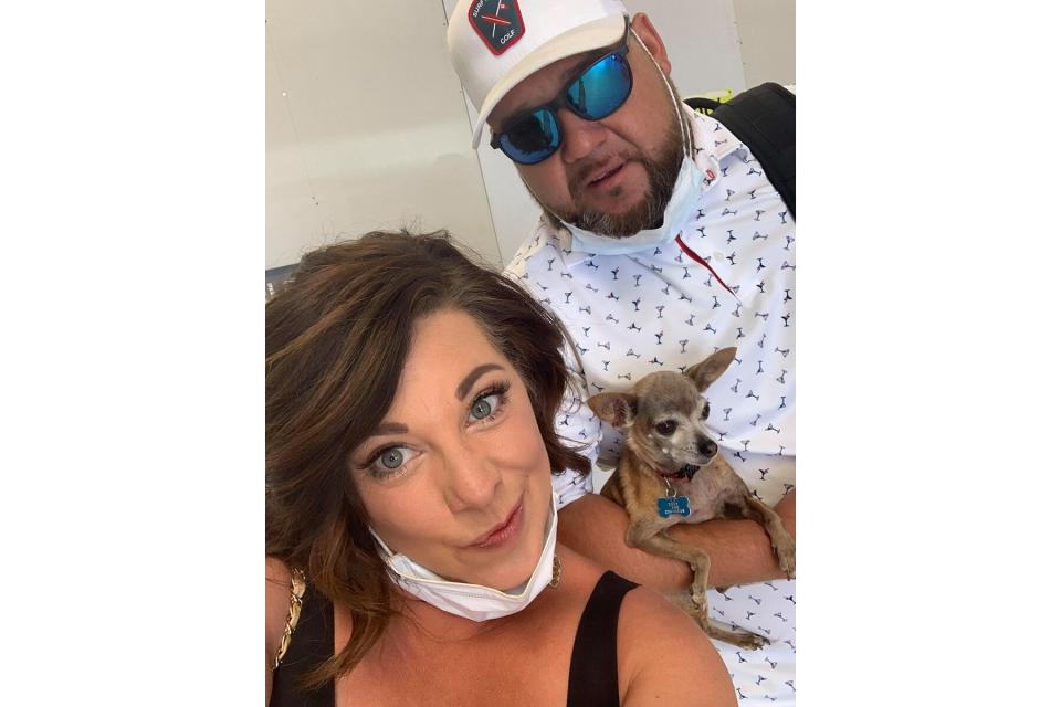 Kristi Owens and husband with the dog