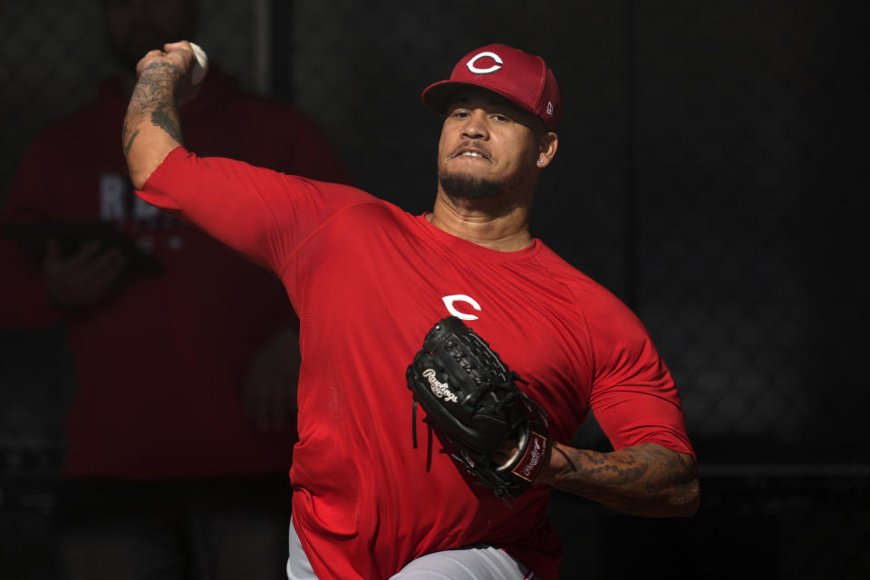 Cincinnati Reds pitcher Frankie Montas throws a pitch during spring training baseball workouts in Goodyear, Ariz., on Wednesday, Feb. 14, 2024. (AP Photo/Carolyn Kaster)