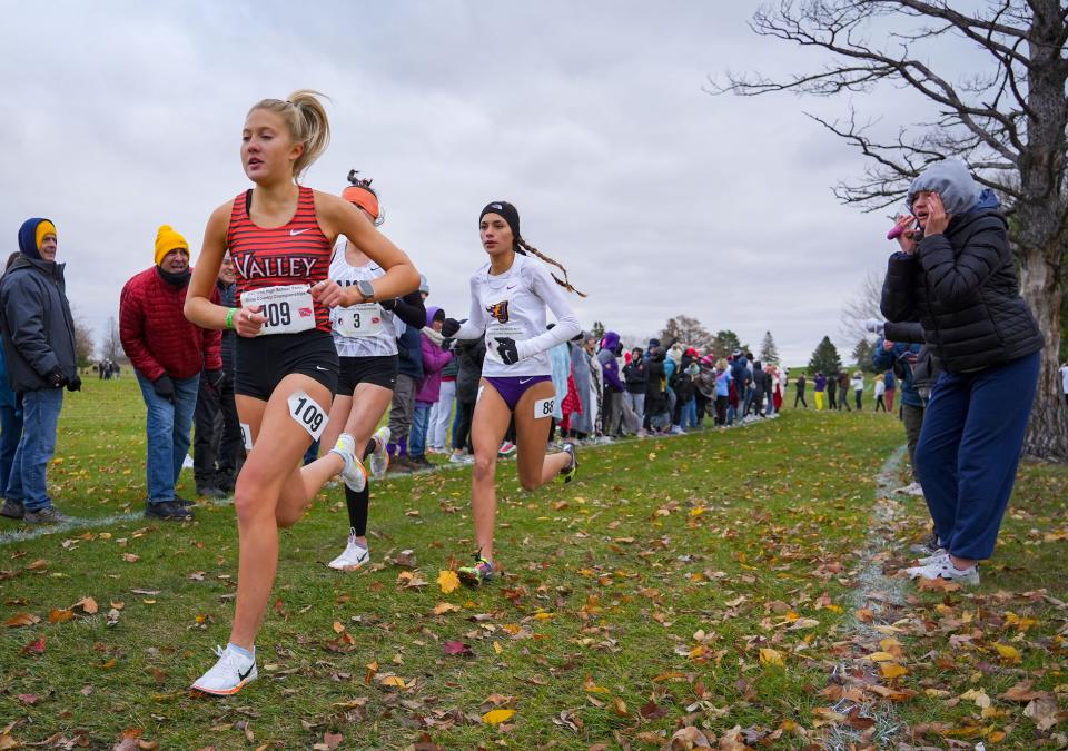 Addison Dorenkamp of Valley leads the 4A girls state cross country championship race in Fort Dodge on Oct. 27, 2023.