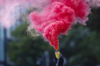 <p>An activist holds a smoke bomb during a protest during the G20 summit in Hamburg, Germany, July 7, 2017. (Photo: Hannibal Hanschke/Reuters) </p>