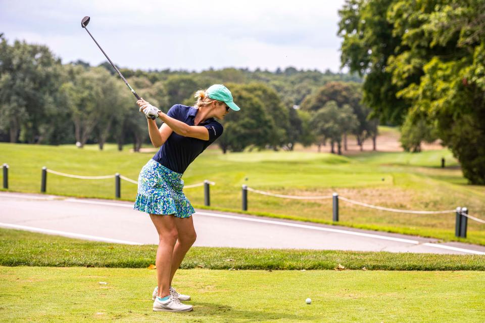 Isabelle Engelsted drives from the tee on hole 13 at the CCNB Women's Fourball Tournament.