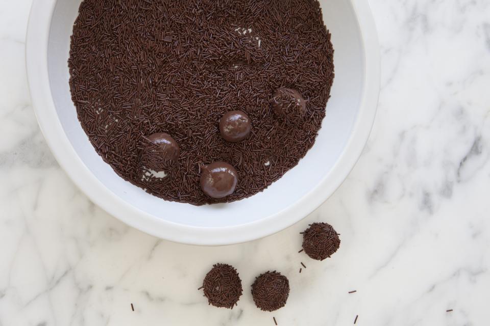 <p>Apparently, brigadeiros were named after a very handsome brigadier (British military officer) who loved chocolate. For brigadeiros, chocolate is combined with sweetened condensed milk.</p><p><a rel="nofollow noopener" href="http://www.thedailymeal.com/recipes/brazilian-brigadeiros-recipe-0?referrer=yahoo&category=beauty_food&include_utm=1&utm_medium=referral&utm_source=yahoo&utm_campaign=feed" target="_blank" data-ylk="slk:Find this recipe here.;elm:context_link;itc:0;sec:content-canvas" class="link "><strong>Find this recipe here.</strong></a></p>