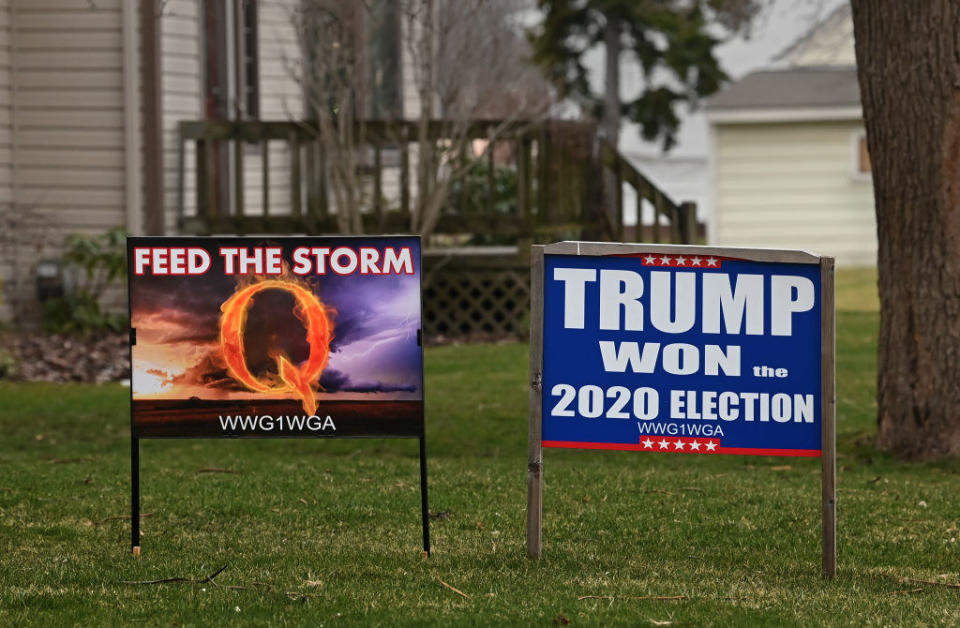 Qanon and Trump signs