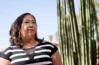 Lisa Phillips at her home Tuesday, April 20, 2021, in Phoenix. When the anniversary of the pandemic arrived, Phillips was not eager for a trip down memory lane. The Phoenix woman had developed symptoms and quarantined with a suspected case of COVID-19 last spring, lost her mother to the disease in July, and been hospitalized herself in November, overwhelmed by grief and isolation. (AP Photo/Ross D. Franklin)