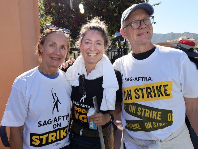 <p>David Livingston/Getty</p> Laurie Metcalf, Zoe Perry and Jeff Perry join the picket line outside Walt Disney Studios on October 16, 2023 in Burbank, California.