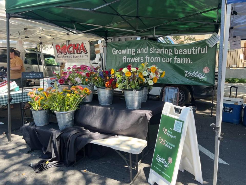 The Kelley Flower Farm stand had two options for shoppers at the Modesto Certified Farmers’ Market, including a desk bouquet for $8 and a farmstand bunch for $25.