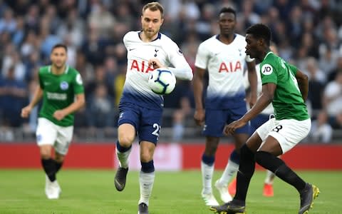 Christian Eriksen of Tottenham Hotspur is challenged by Yves Bissouma of Brighton and Hove Albion during the Premier League match between Tottenham Hotspur and Brighton & Hove Albion at Tottenham Hotspur Stadium on April 23, 2019 in London, United Kingdom. - Credit: Getty Images