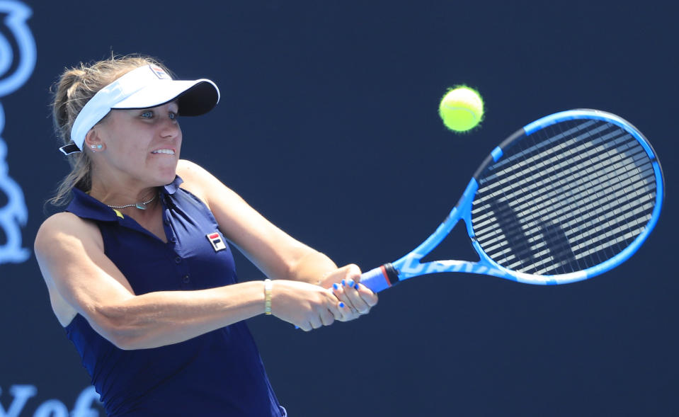 Sofia Kenin of the U.S. hits a backhand to Anna Karolina Schmiedlova of Slovakia during the women's singles finals at the Hobart International tennis tournament in Hobart, Australia, Saturday, Jan. 12, 2019. (Rob Blakers/AAP Image via AP)