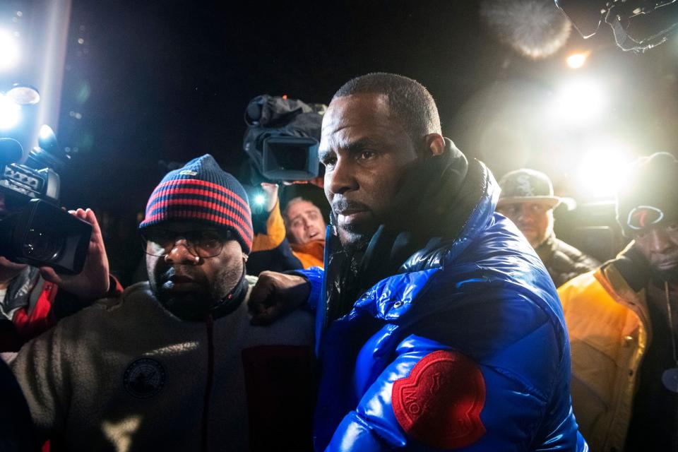 R. Kelly surrenders to authorities at Chicago First District police station, Friday, Feb. 22, 2019.  R&B star R. Kelly was taken into custody after arriving Friday night at a Chicago police precinct, hours after authorities announced multiple charges of aggravated sexual abuse involving four victims, including at least three between the ages of 13 and 17.