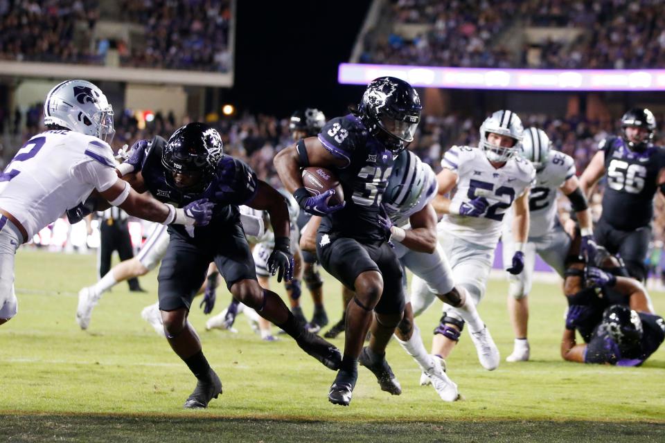 TCU running back Kendre Miller (33) scores a touchdown against Kansas State in the fourth quarter at Amon G. Carter Stadium.