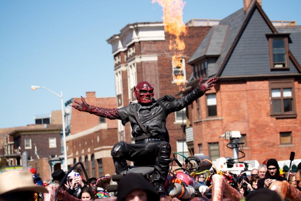 The Nain Rouge taunts a crowd of thousands at the intersection of Canfield Street and Second Avenue duing the Marche du Nain Rouge in Detroit on March 22, 2015.
