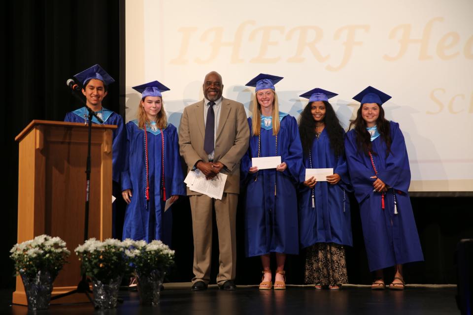 Andres Viveros, Callie McFarland, Lydia Olejniczak, Filmawit Okubay and Pauline Galindo pose for a photo after receiving Iowa Hospital Education & Research and Dallas County Hospital Foundation Scholarships during the Senior Awards Assembly on Wednesday, May 17, 2023, at Perry Performing Arts Center.