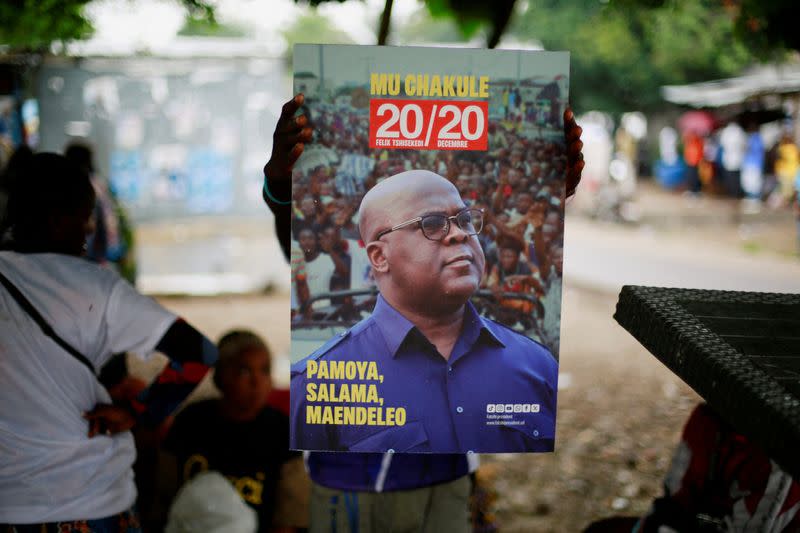 FILE PHOTO: Congoleses wait for full provisional results of presidential election in Kinshasa