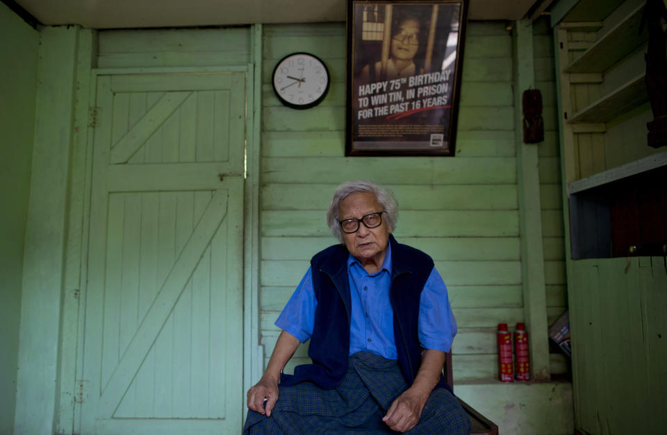 In this Oct. 24, 2013 photo, Win Tin, a former political prisoner and an opposition party stalwart poses for a picture at his home in Yangon, Myanmar. Win Tin, a prominent journalist who became Myanmar's longest-serving political prisoner after challenging military rule by co-founding the National League for Democracy has died. He was 85. He died of renal failure Monday morning, April 21, 2014, family said. (AP Photo/Gemunu Amarasinghe)