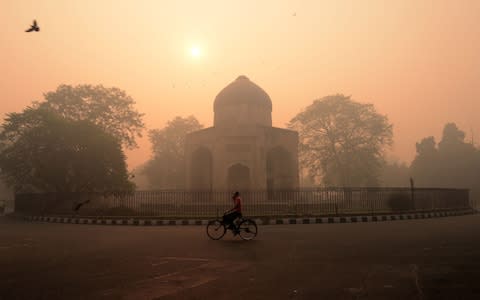 Smog envelopes New Delhi, one of the worst polluted cities in the world  - Credit: AFP