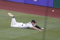 The ball bounces past Pittsburgh Pirates center fielder Bryan Reynolds on a two-run double by Boston Red Sox's Christian Arroyo during the second inning of a baseball game Wednesday, Aug. 17, 2022, in Pittsburgh. (AP Photo/Keith Srakocic)