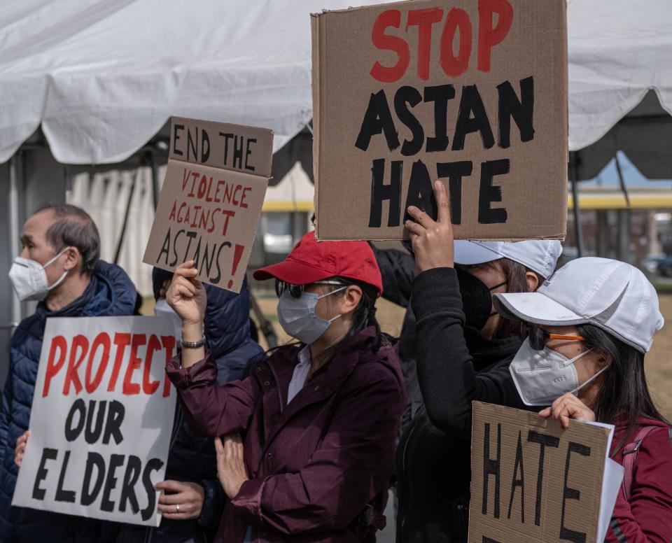 <p>People march during a Stop Asian Hate rally in downtown Detroit, Michigan in March, as part of  a nation wide protest in solidarity against hate crimes directed towards Asian Americans </p> (AFP via Getty Images)