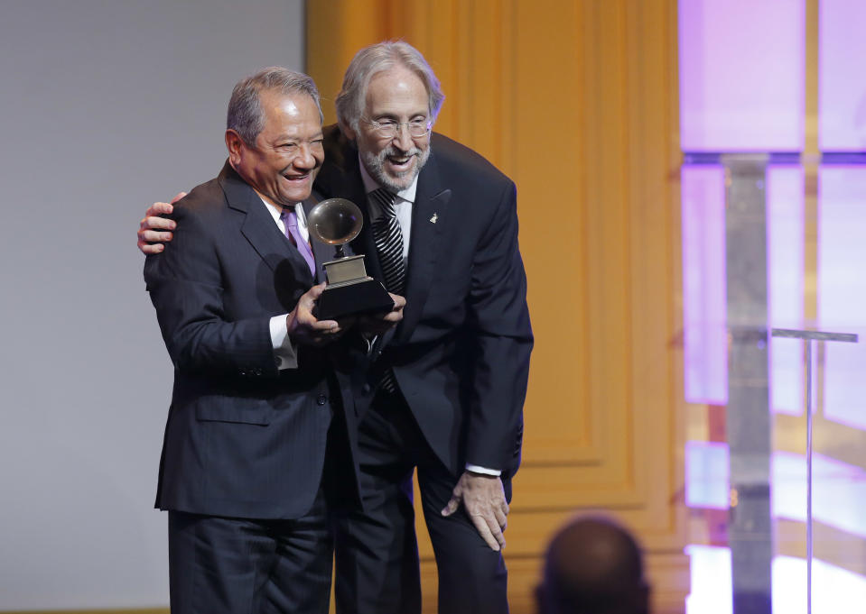 Armando Manzanero and The Recording Academy president/CEO Neil Portnow attend The 56th Annual GRAMMY Awards - Special Merit Awards Ceremony, on Saturday, Jan. 25, 2014 in Los Angeles. (Photo by Todd Williamson/Invision/AP)