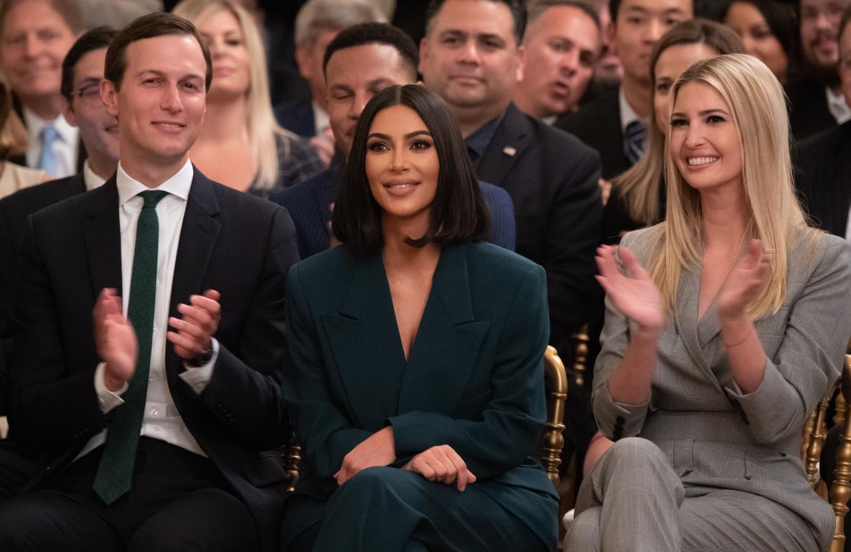 Kim Kardashian(C), Ivanka Trump(R) and Jared Kushner applaud as US President Donald Trump speaks about second chance hiring and criminal justice reform in the East Room of the White House in Washington, DC, June 13, 2019.