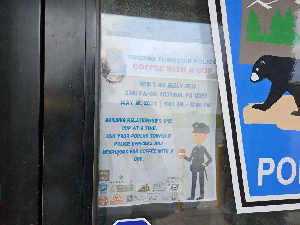 A flyer for the May 18, 2024, Coffee with a Cop event can be seen posted on the Pocono Township Police Department door.