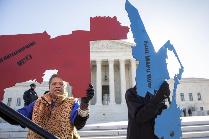 Activists protest partisan gerrymandering at the Supreme Court in Washington, D.C. on Mar. 26, 2019. (Carolyn Kaster / AP file)