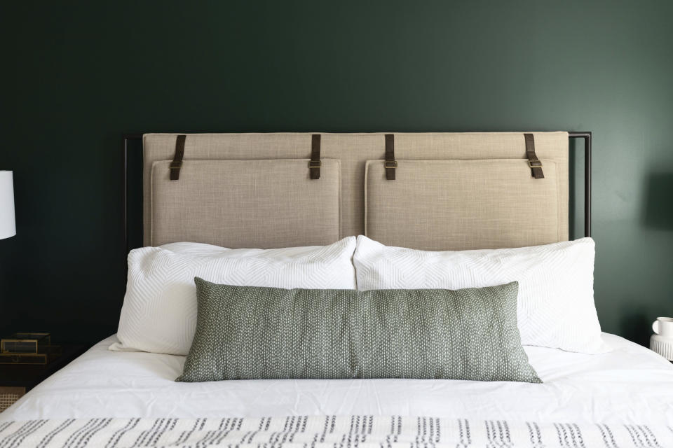 This image provided by LifeCreated shows a bedroom. Benjamin Moore's Hunter Green paint was used in the bedroom of this Paradise Valley, AZ home. "When combined with soft lighting, these hues create a cozy effect that can be applied to any room,' says designer Lauren Lerner of Living with Lolo. (Stephanie Studer/LifeCreated via AP)