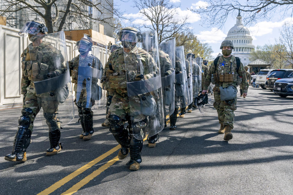 Members of the National Guard leave the Capitol perimeter the they had been guarding, Friday, April 2, 2021, after a car crashed into a barrier on Capitol Hill in Washington. (AP Photo/Jacquelyn Martin)