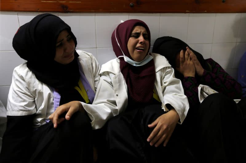 FILE PHOTO: Colleagues of Palestinian nurse Razan Al-Najar, who was killed during a protest at the Israel-Gaza border, react at a hospital in the southern Gaza Strip