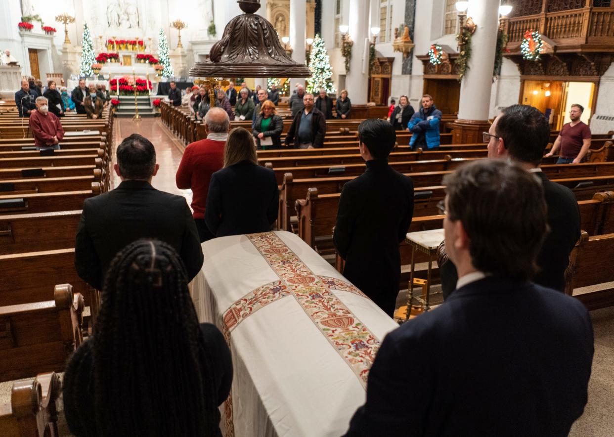 A ceremonial casket is prepared to be brought to the front of the church during the annual Pope Francis Center Homeless Persons' Memorial on Wednesday, December 21, 2022, at Ss. Peter and Paul Jesuit Church in Downtown Detroit in honor of the lives of Detroiters who died while homeless this year. The service included a reading of the names of people experiencing homelessness who passed in 2022.