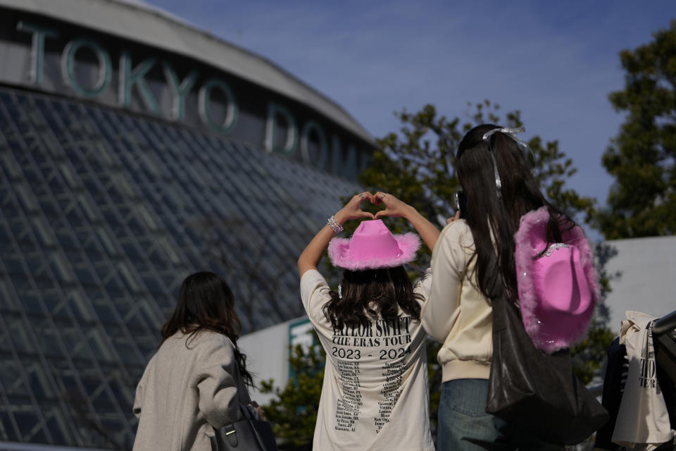 A woman poses for a photo before Taylor Swift's concert at Tokyo Dome in Tokyo, Saturday, Feb. 10, 2024. (AP Photo/Hiro Komae)