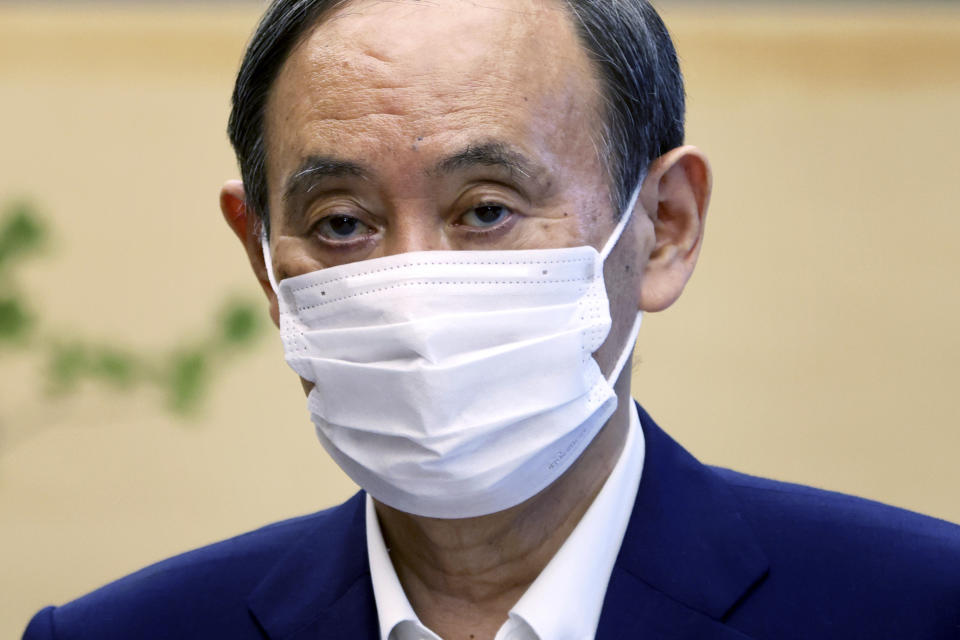 Japanese Primm Minister Yoshihide Suga pauses during a meeting with International Paralympic Committee President Andrew Parsons, in Tokyo Friday, Sept.3, 2021. Suga said Friday he won’t run for leadership of the governing party at the end of this month, paving the way for a new Japanese leader after just a year in office. (Behrouz Mehri/Pool Photo via AP)