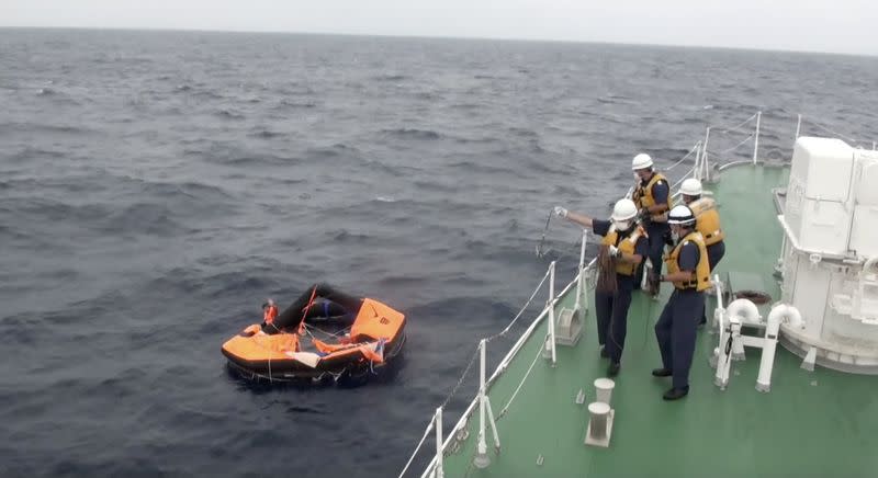 Filipino crew member of Gulf Livestock 1 is rescued by Japan Coast Guard crew on vessel Kaimon, at the East China Sea