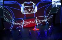 Actors performs during the Bugatti presentation at the Volkswagen group night at the Frankfurt motor show September 9, 2013. The world's biggest auto show is open to the public September 14 -22. REUTERS/Kai Pfaffenbach (GERMANY - Tags: BUSINESS TRANSPORT)