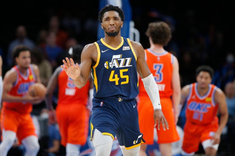 Utah's Donovan Mitchell (45) reacts after making a shot during an NBA basketball game between the Oklahoma City Thunder and the Utah Jazz at Paycom center in Oklahoma City Wednesday, Nov. 24, 2021. The Thunder lose to the Jazz 110-104.