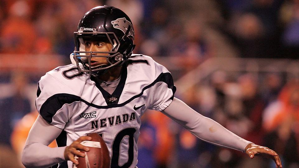 colin kaepernick in a nevada football jersey, running with the ball during a game