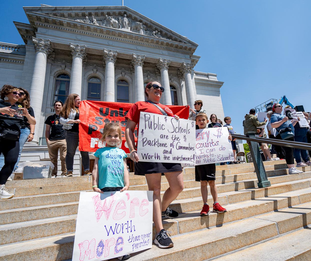 (Left to right) 5-year-old Charlotte Yundt, Katie Wilkes, President of Wauwatosa Education Association and 7-year-old Keelan Yundt, attend the Wisconsin Education Association Council's rally as a family to support Governor Evers’ education budget on Saturday May 20, 2023 at the Wisconsin State Capitol in Madison, Wis.