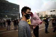 Israelis protest against the government's response to the financial fallout of the coronavirus disease (COVID- 19) crisis at Rabin square in Tel Aviv