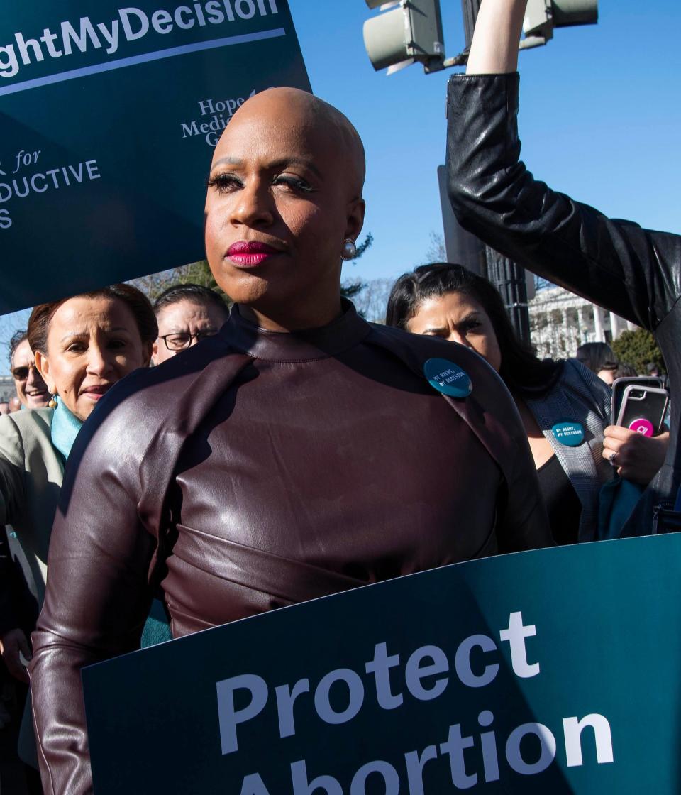 Rep. Ayanna Pressley, D-Mass., walks to the Supreme Court with other members of Congress as activists rally outside the Supreme Court in Washington, March 4. 2020.