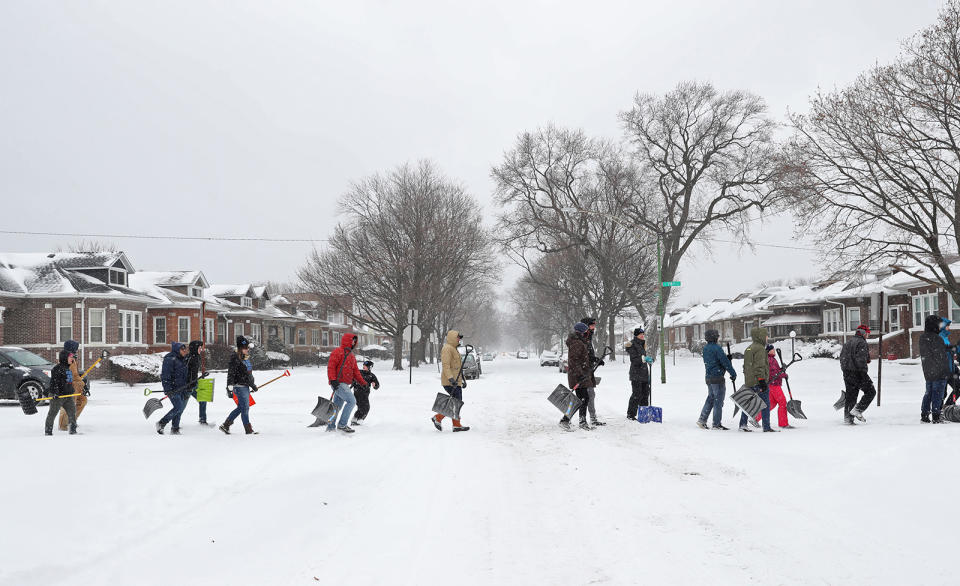 A 12-year-old girl reportedly died after the snow fort she was building with a friend collapsed. Pictured above, volunteers in Illinois walk to shovel a main street on Chicago’s south side. (Photo: John J. Kim/Chicago Tribune/TNS)